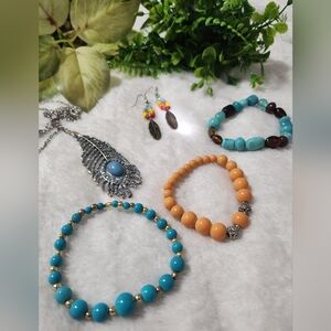 Handmade bracelets and earrings with a feather pendant necklace 19 inches long